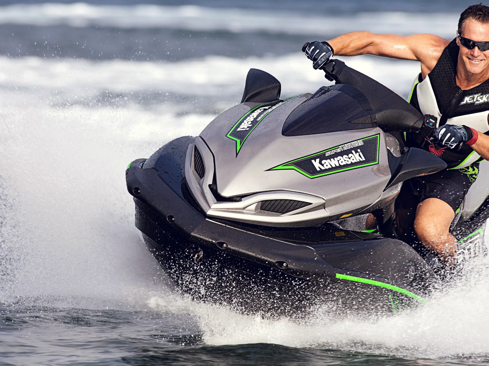 Jet ski activity beside a yacht in Dubai